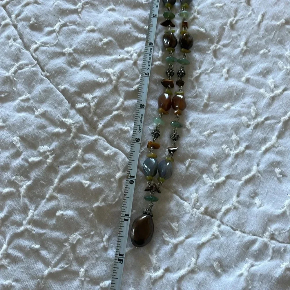 Beautiful necklace. Gray, brown and light aqua stones with silver tone accents.